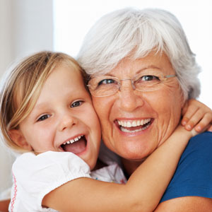 girl-and-grandma-smiling-and-hugging-sq-300
